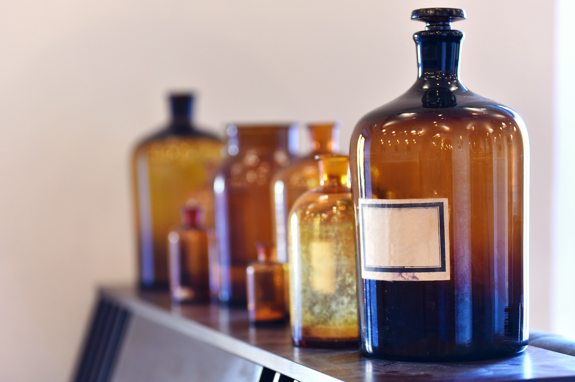 Vintage medicine bottles. Empty scent bottles in old pharmacy